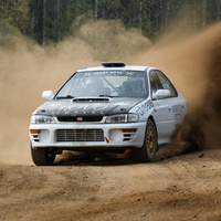 Driving behind the wheel of a Subaru Impreza on a gravel track (5 laps)